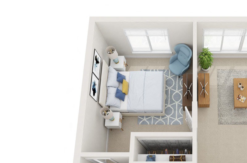 A white room with a bed, a couch, a chair, a table, a potted plant, and a rug.